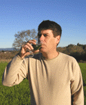 Man drinking glass of Freeze-Dried wheat grass